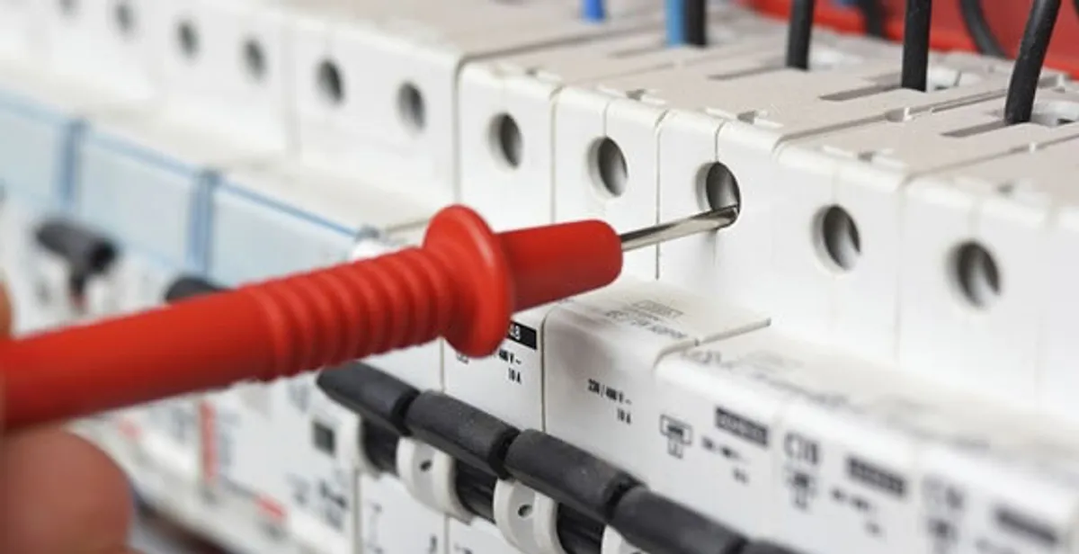 Electrical contractor testing circuit breakers during electrical repair in Longboat Key, FL