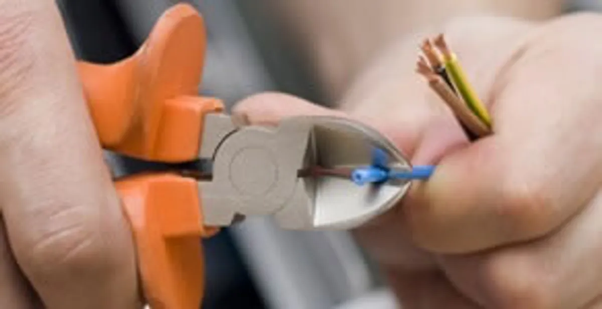 professional electrical services showing precise wire cutting by licensed electricians in Bradenton, FL