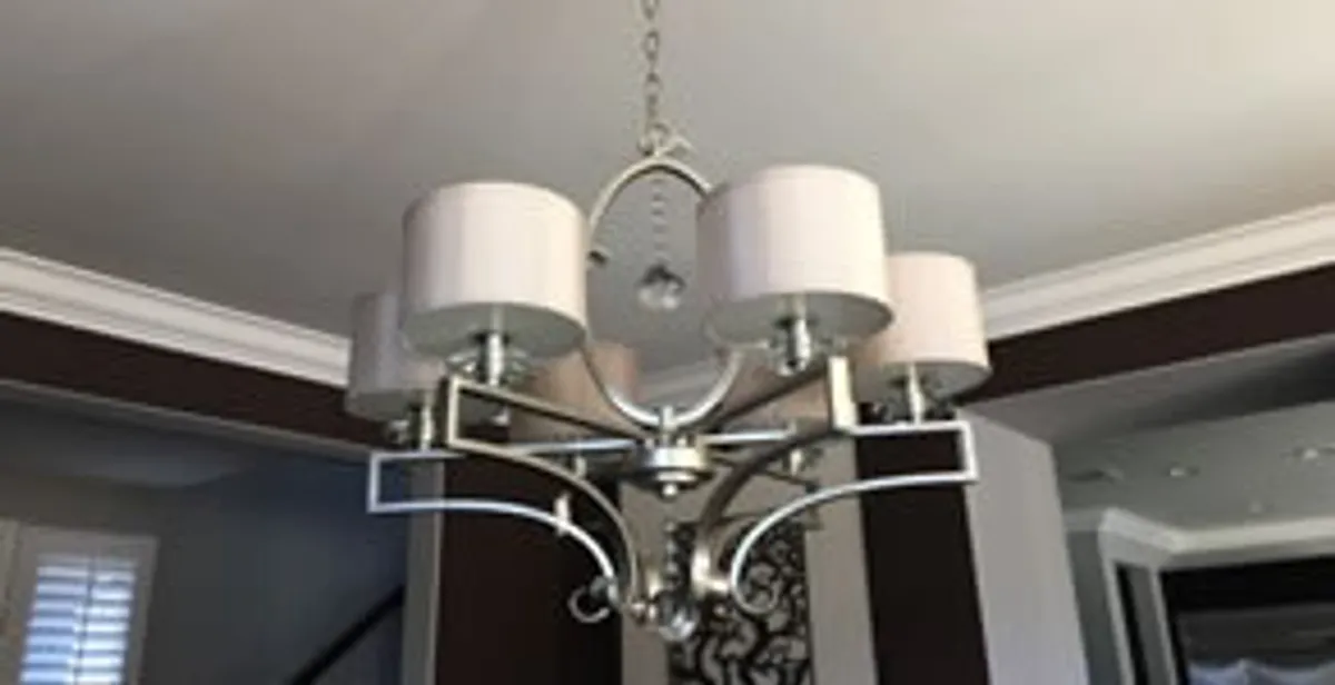 Modern chandelier installation with multiple light fixtures in Bradenton, FL